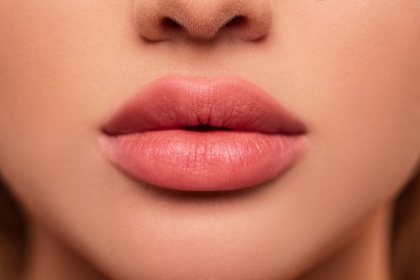 A young woman's full lips, close-up.